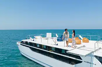 couple standing on the sun deck